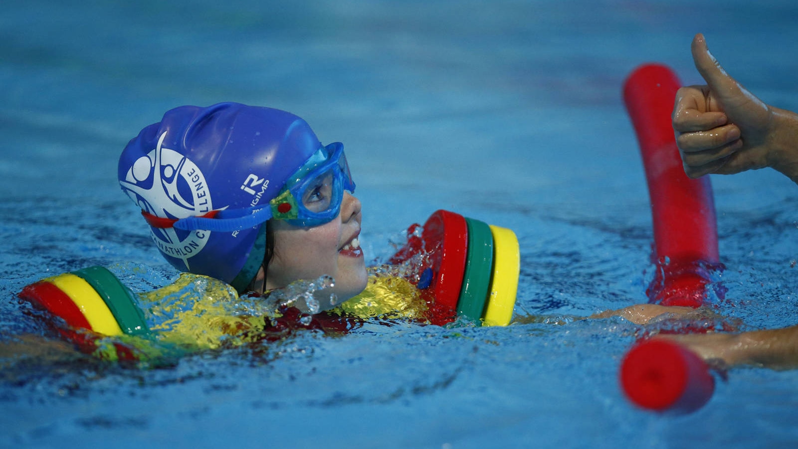 A young pupil from Treetops School in Grays, Essex, competes at the Aquatics Centre