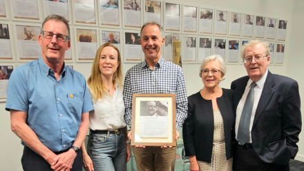 Family of Hall of Famer Norman Sarsfield presented with framed tribute